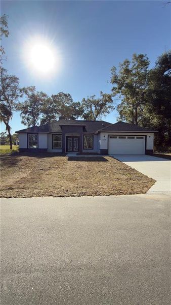 Front exterior of a new home in , Belleview, FL, highlighting curb appeal (Image 1). Front exterior of a new home in , Belleview, FL, highlighting curb appeal (Image 1).