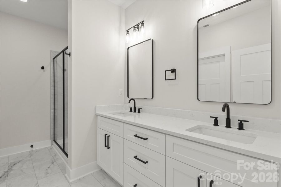 Primary bath with two vanities. All soft close drawers and cabinets