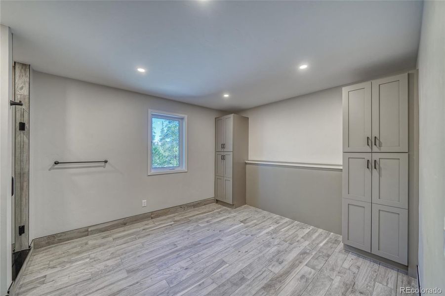 main level Guest bedroom 1 with built ins, ensuite bath