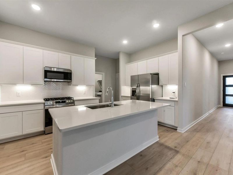 Furnished interior view inside a new home in Sunterra, Katy (Image 7).