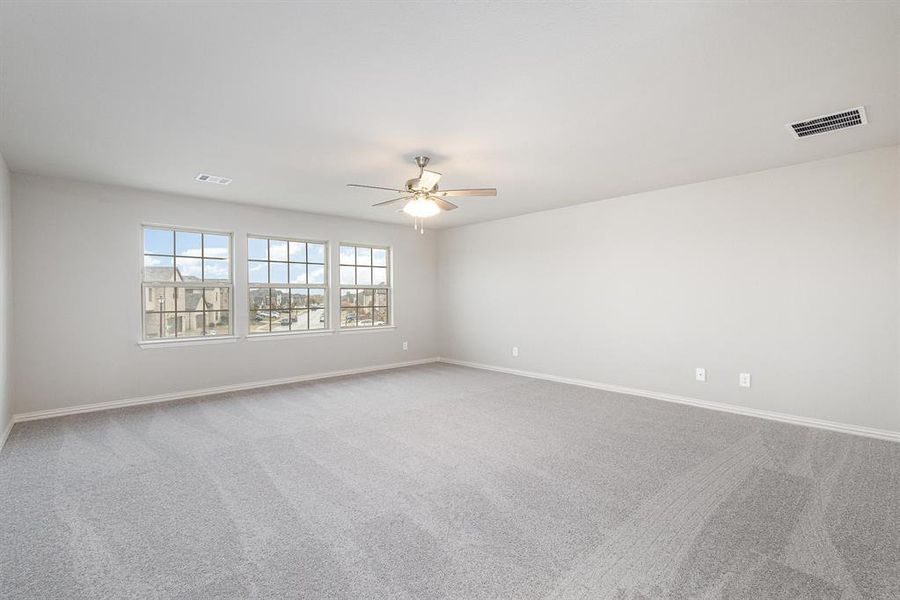 Unfurnished room with carpet floors and ceiling fan