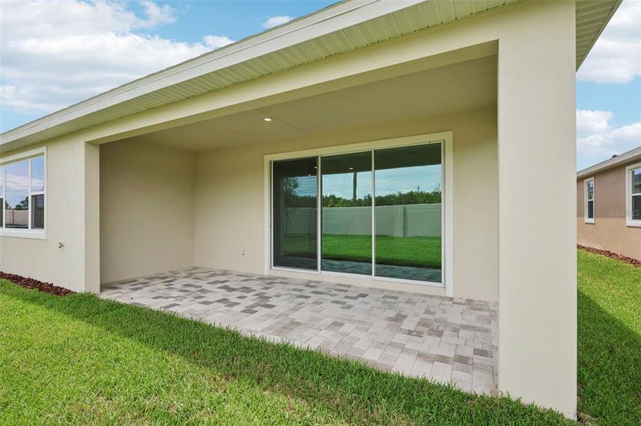 Exterior details and patio area of a home in Primrose at Longleaf, New Port Richey (Image 4).