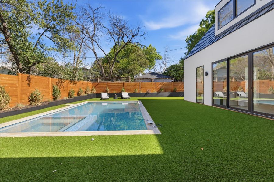 A well-maintained lawn and private swimming pool complement this modern home's exterior. A well-maintained lawn and private swimming pool complement this modern home's exterior.