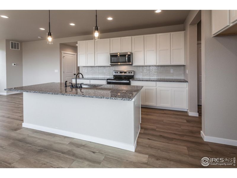 Furnished interior view inside a new home in Promontory Point, Greeley (Image 17).