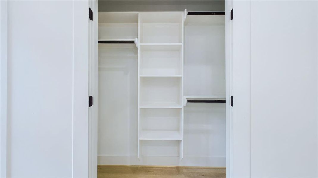 A sizable closet is offered in the secondary bedroom, with extensive hanging and shelving space along 10ft ceilings for extra storage.