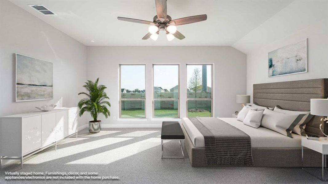 Bedroom featuring carpet flooring, vaulted ceiling, and ceiling fan