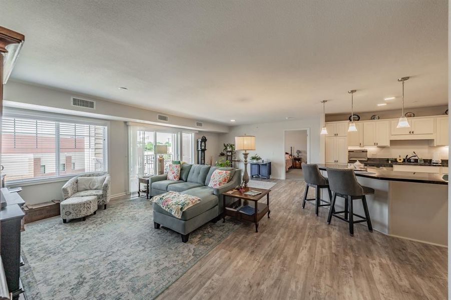 Open concept living space with flow between the kitchen and living room designed to feel spacious, welcoming, and connected.