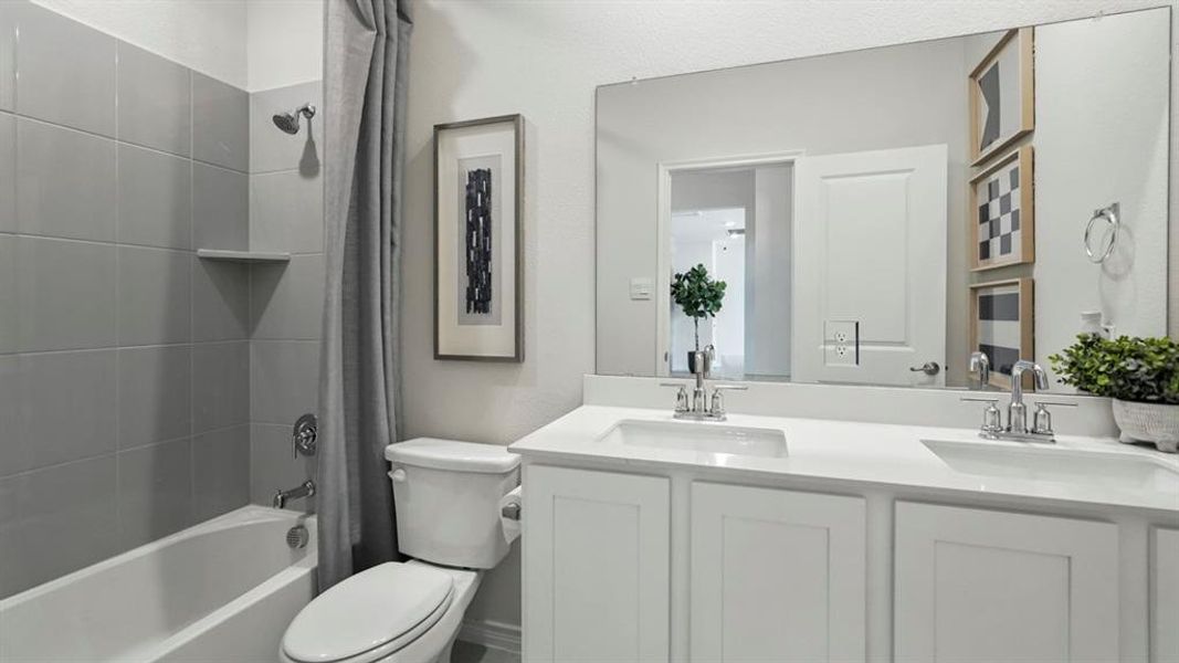 Double vanity featuring undermount sinks and chrome fixtures