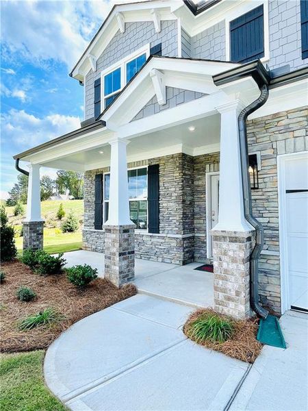 Exterior details and patio area of a home in Hopewell Reserve: Hopewell - 40' Value, Cumming (Image 2). Exterior details and patio area of a home in Hopewell Reserve: Hopewell - 40' Value, Cumming (Image 2).