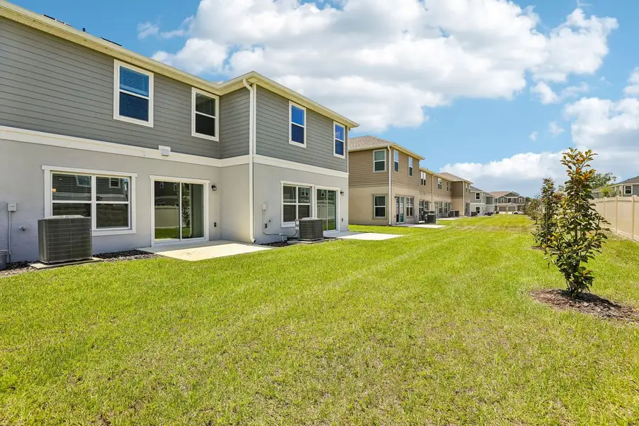 Exterior details and patio area of a home in Reserve at Forest Lake Townhomes, Lake Wales (Image 4). Exterior details and patio area of a home in Reserve at Forest Lake Townhomes, Lake Wales (Image 4).
