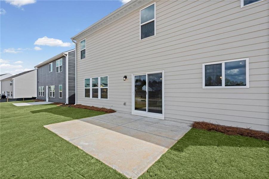 Exterior details and patio area of a home in Twin Lakes, Hoschton (Image 32).