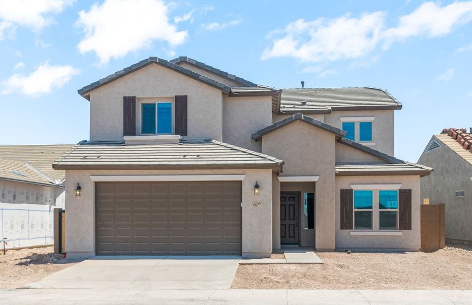 Front exterior of a new home in Parkside at Anthem at Merrill Ranch, Florence, AZ, highlighting curb appeal (Image 2). Front exterior of a new home in Parkside at Anthem at Merrill Ranch, Florence, AZ, highlighting curb appeal (Image 2).