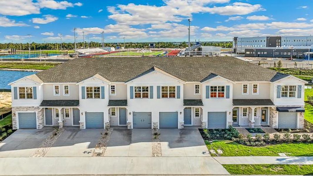Front exterior of a new home in Ashcombe Wellen Park, Venice, FL, highlighting curb appeal (Image 2). Front exterior of a new home in Ashcombe Wellen Park, Venice, FL, highlighting curb appeal (Image 2).