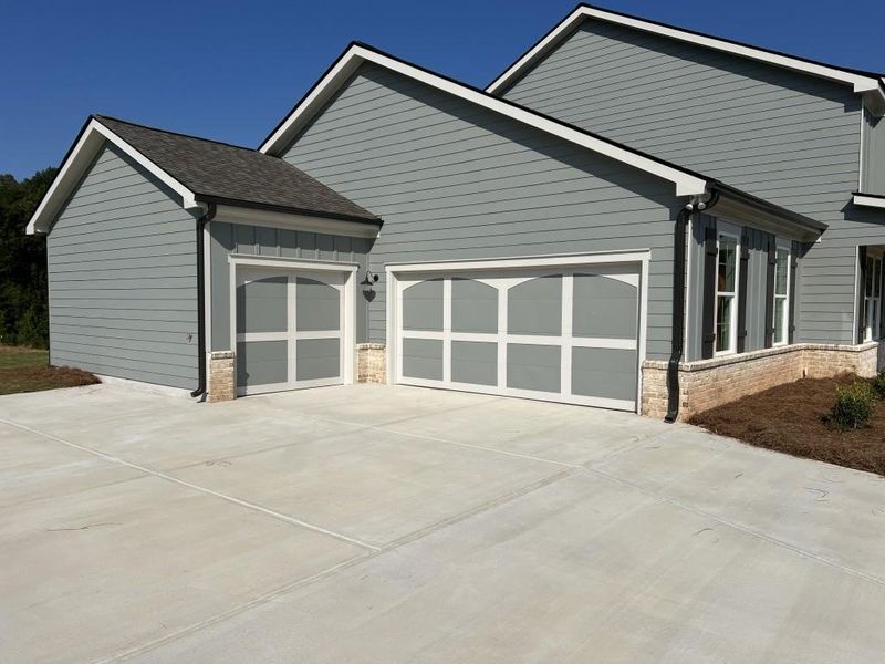 Front exterior of a new home in , Good Hope, GA, highlighting curb appeal (Image 21).
