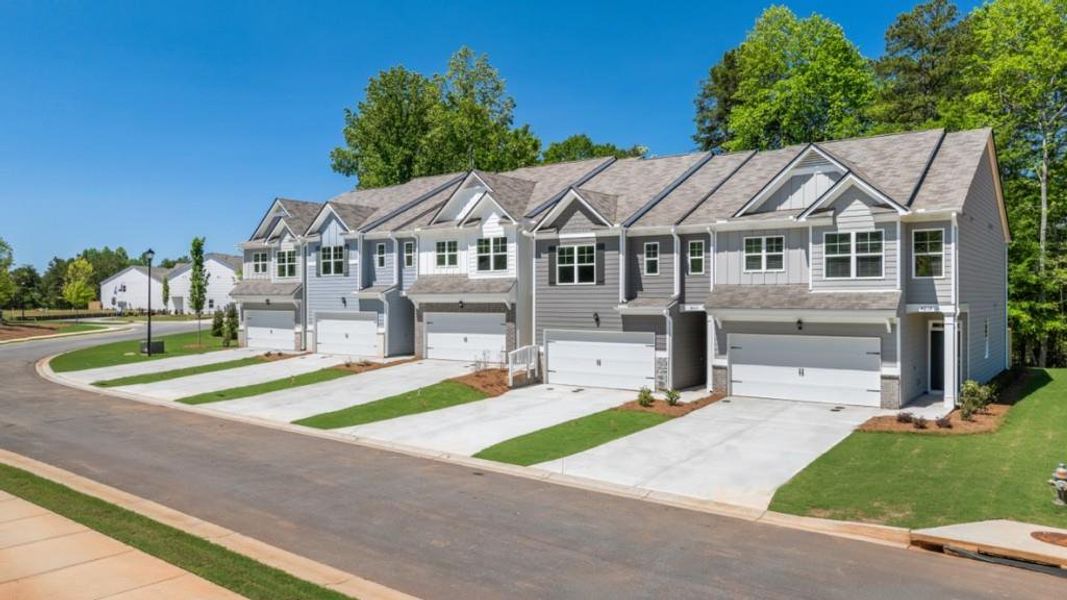 Front exterior of a new home in Falcon Landing, Gainesville, GA, highlighting curb appeal (Image 2). Front exterior of a new home in Falcon Landing, Gainesville, GA, highlighting curb appeal (Image 2).
