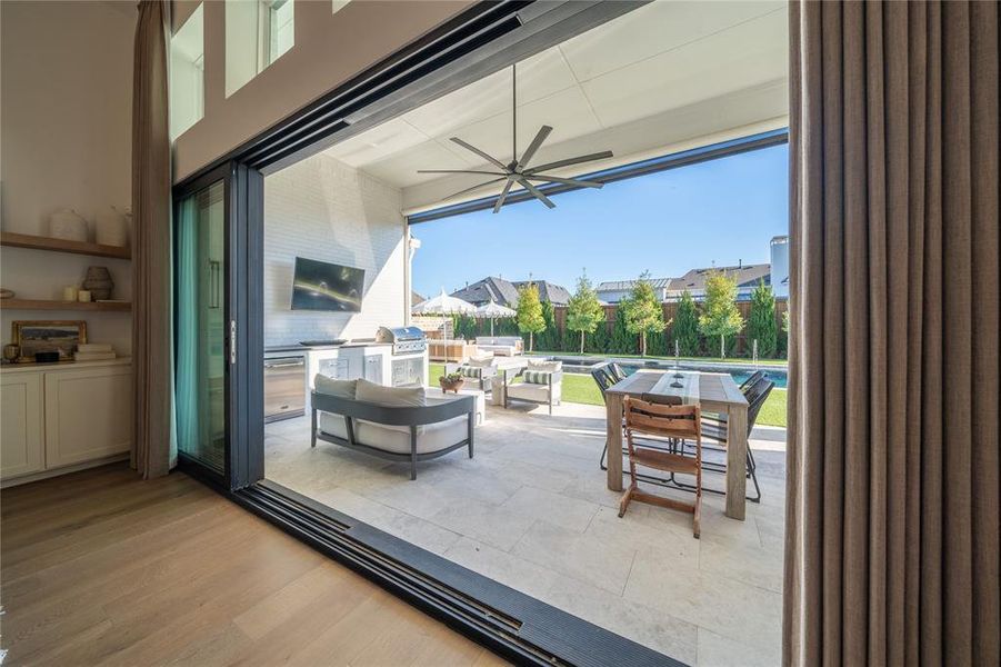 View of patio featuring a grill