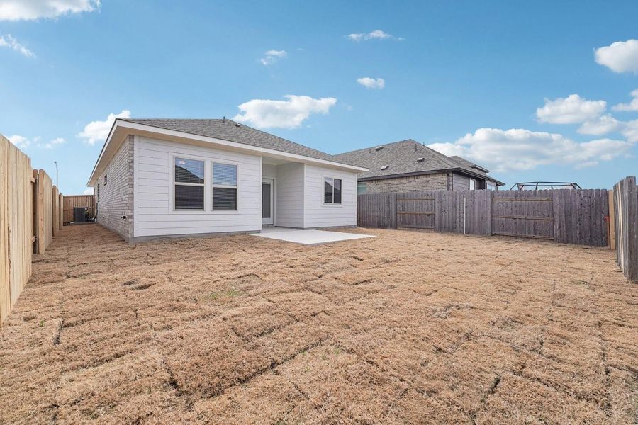 A spacious backyard with new sod offers ample room for outdoor activities, complementing the home's pristine exterior. A spacious backyard with new sod offers ample room for outdoor activities, complementing the home's pristine exterior.