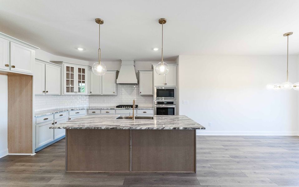 Furnished interior view inside a new home in Aden Woods, Fairview (Image 6).