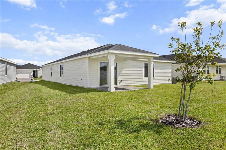 Exterior details and patio area of a home in Colbert Landings, Palm Coast (Image 3).