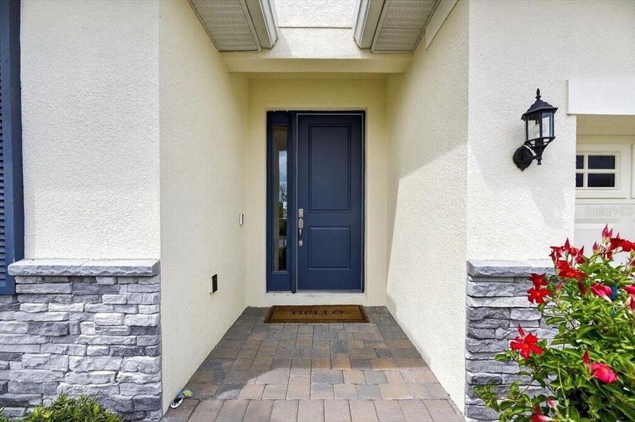 Front exterior of a new home in Marisol Pointe at MiraBay Florida Series, Apollo Beach, FL, highlighting curb appeal (Image 19).