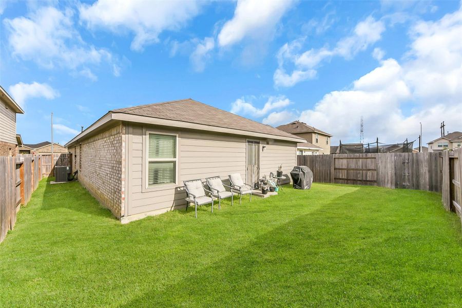 Exterior details and patio area of a home in Burnet Fields at Baytown Crossings, Baytown (Image 17).