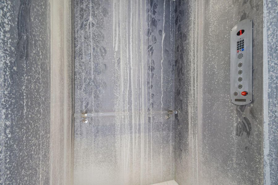 An integrated in-home elevator provides convenient access across multiple floors of the residence. An integrated in-home elevator provides convenient access across multiple floors of the residence.
