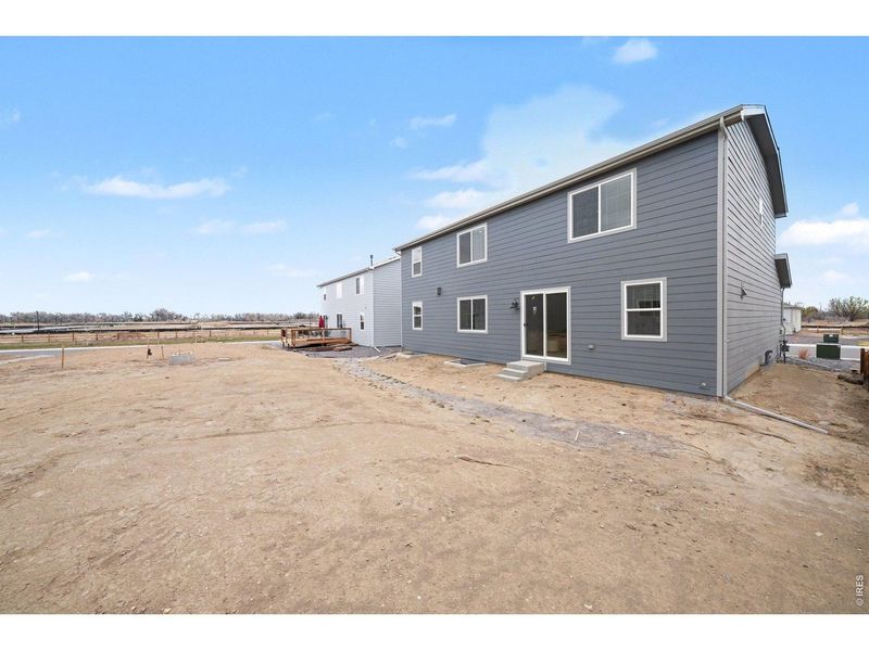 Exterior details and patio area of a home in Poudre Heights: The Alpine Collection, Windsor (Image 28).