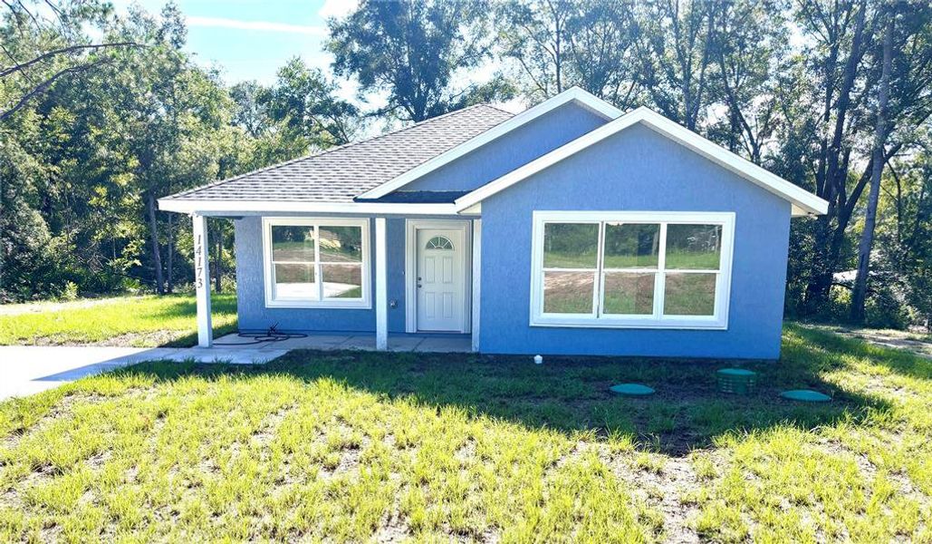 Front exterior of a new home in , Summerfield, FL, highlighting curb appeal (Image 16).