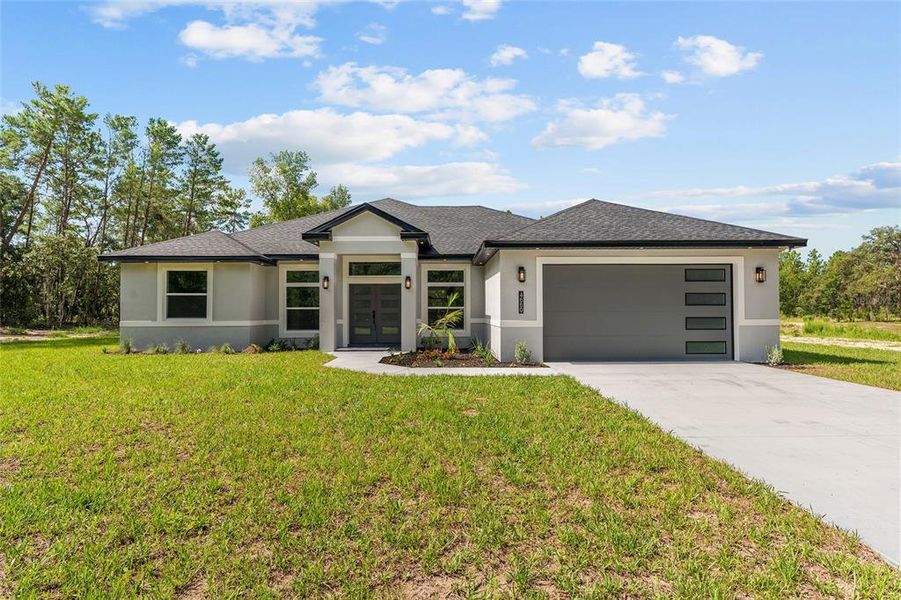 Front exterior of a new home in , Ocala, FL, highlighting curb appeal (Image 22). Front exterior of a new home in , Ocala, FL, highlighting curb appeal (Image 22).