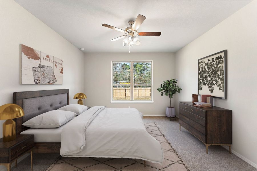 A bedroom with a bed and a fan.