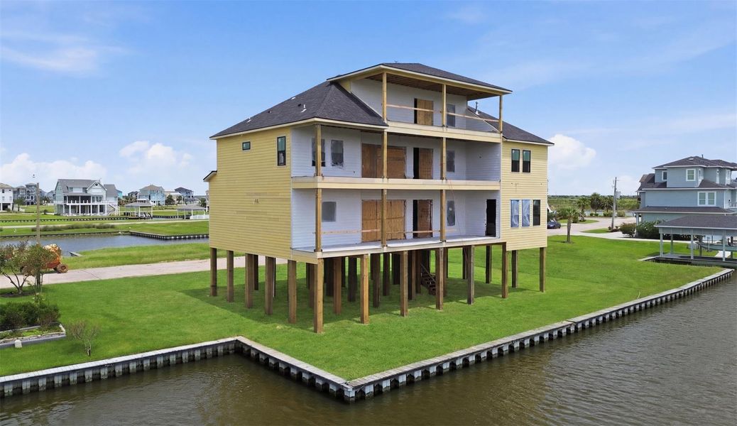 Front exterior of a new home in , Hitchcock, TX, highlighting curb appeal (Image 7).