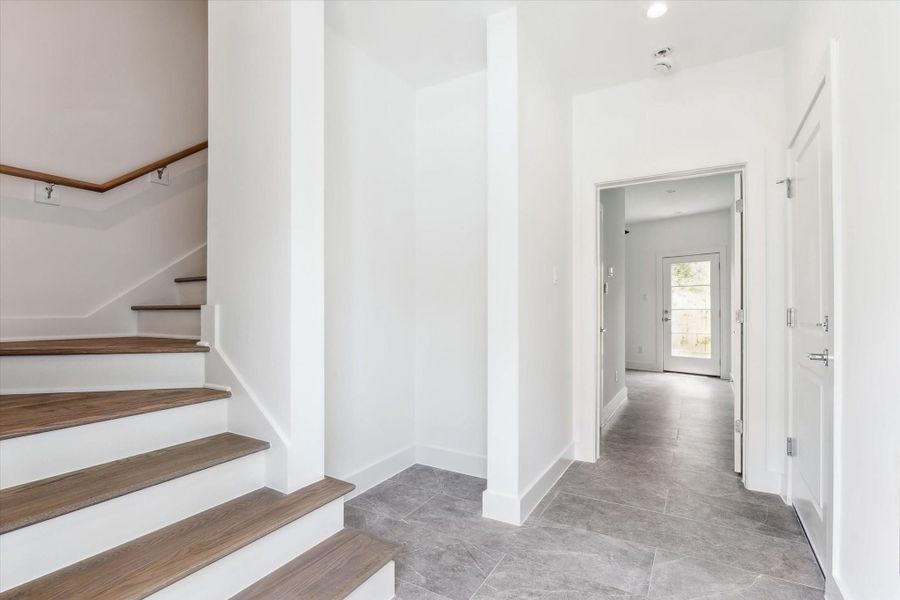 GRAND Entry * Porcelain Tile * Hardwood Floors On the Stairs. GRAND Entry * Porcelain Tile * Hardwood Floors On the Stairs.