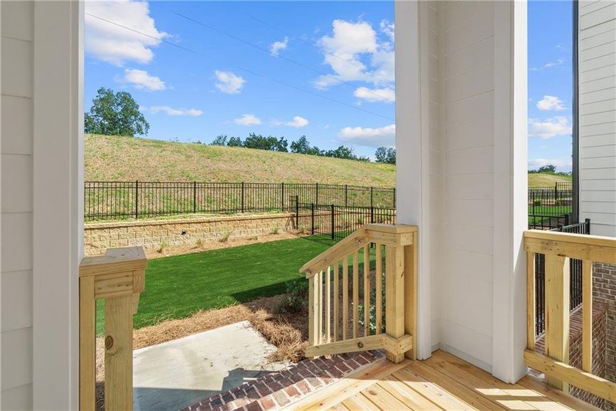 Exterior details and patio area of a home in Palisades Single Family, Cumming (Image 23).