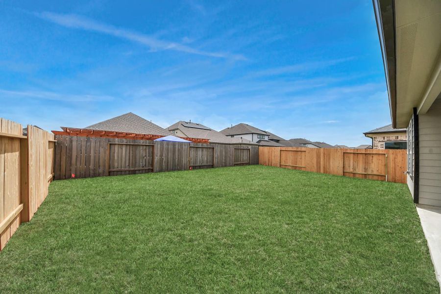 Backyard retreat, offering an abundance of space for kids to play and explore. The possibilities are endless in this outdoor haven, where the joy of open-air activities and family gatherings awaits. Backyard retreat, offering an abundance of space for kids to play and explore. The possibilities are endless in this outdoor haven, where the joy of open-air activities and family gatherings awaits.