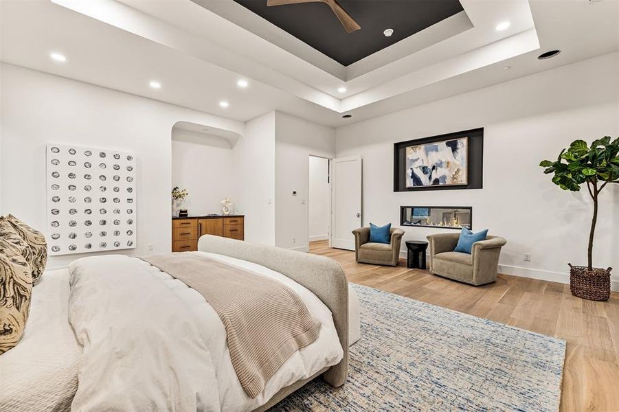 Tucked away on the main floor, the primary bedroom offers separation from the rest of the home for added privacy