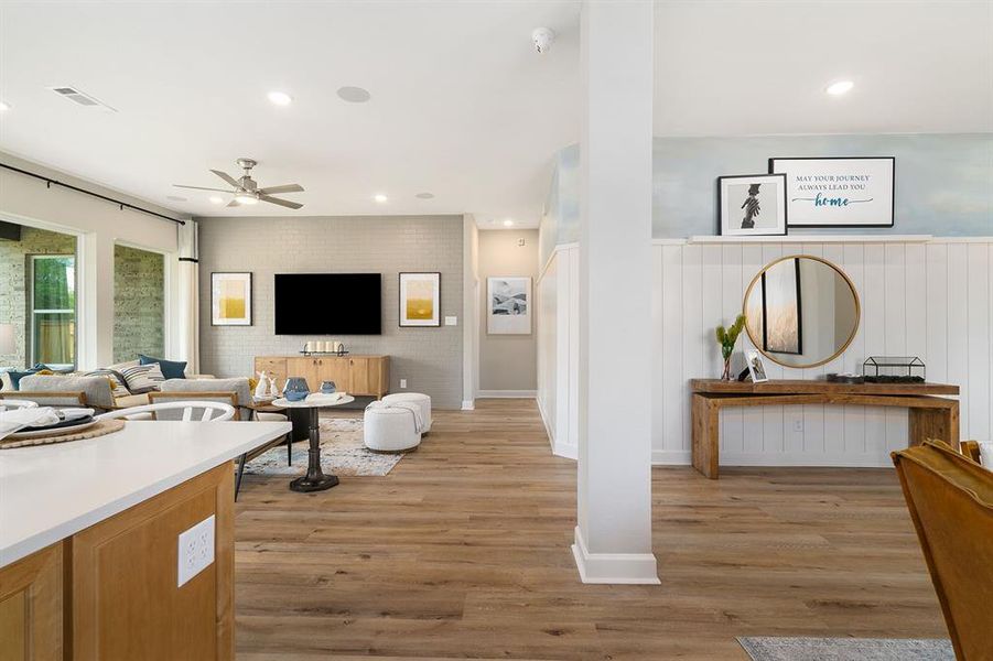 View from Kitche/dining towards Living and entry. Shiplap wall with faux painting above!