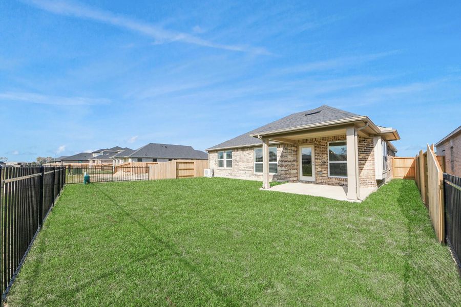 Exterior details and patio area of a home in Laurel Landing: Landmark Collection, Alvin (Image 4). Exterior details and patio area of a home in Laurel Landing: Landmark Collection, Alvin (Image 4).