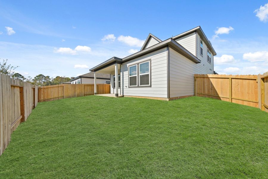 Exterior details and patio area of a home in Lexington Heights, Willis (Image 3). Exterior details and patio area of a home in Lexington Heights, Willis (Image 3).