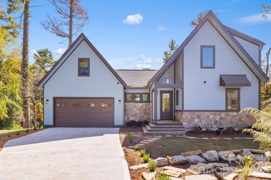 Front exterior of a new home in , Hendersonville, NC, highlighting curb appeal (Image 19).