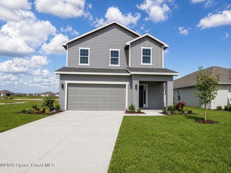 Front exterior of a new home in St. John's Preserve, Palm Bay, FL, highlighting curb appeal (Image 1). Front exterior of a new home in St. John's Preserve, Palm Bay, FL, highlighting curb appeal (Image 1).