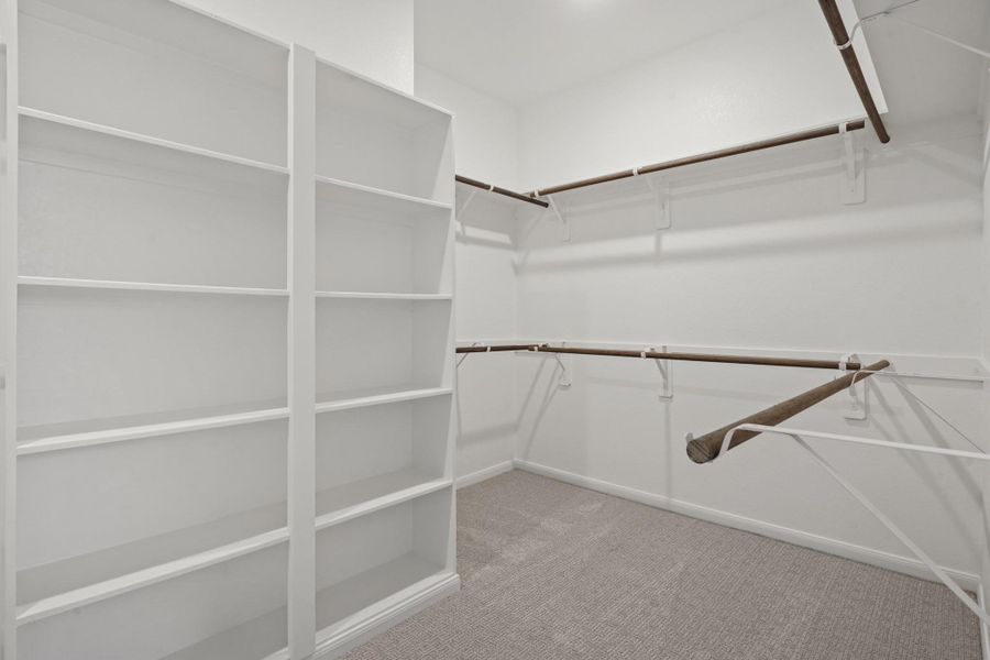 Walk-in closet in owner's suite (*Photo not of actual home and used for illustration purposes only.) Walk-in closet in owner's suite (*Photo not of actual home and used for illustration purposes only.)