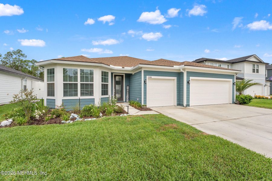 Front exterior of a new home in Bradley Creek, Green Cove Springs, FL, highlighting curb appeal (Image 1). Front exterior of a new home in Bradley Creek, Green Cove Springs, FL, highlighting curb appeal (Image 1).