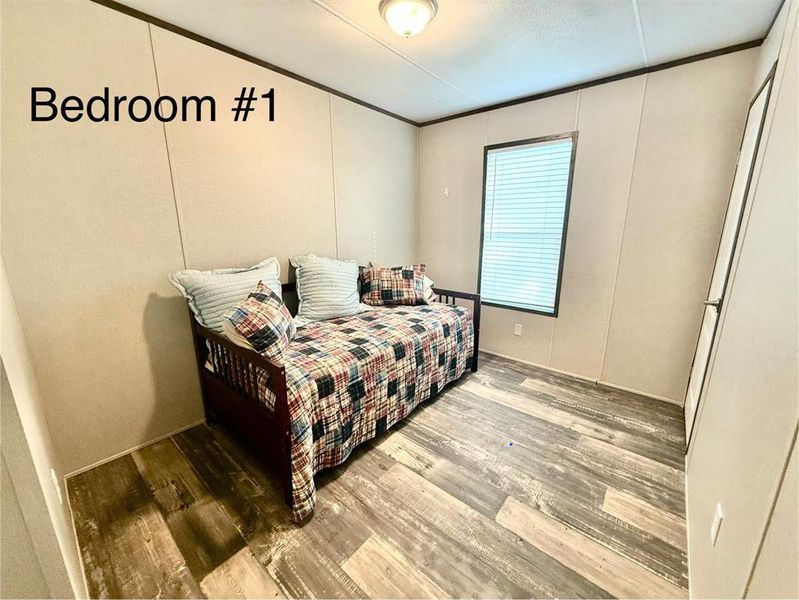 Bedroom featuring wood finished floors