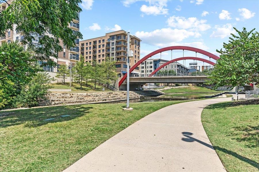 View of home's community featuring a water view and a lawn View of home's community featuring a water view and a lawn