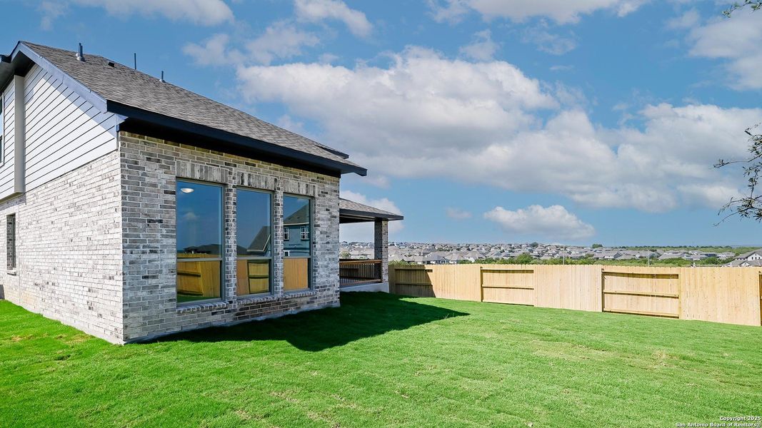 Exterior details and patio area of a home in Homestead 55', Schertz (Image 4).