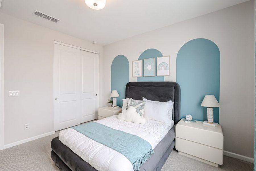 A bedroom with a bed and lamps. A bedroom with a bed and lamps.