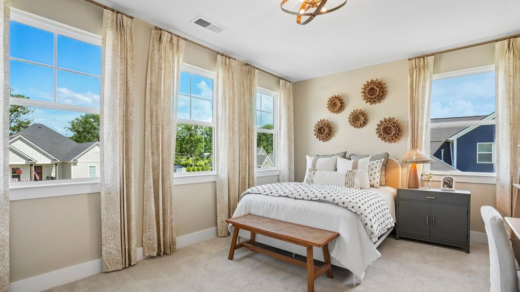 Secondary bedroom with carpet and windows Secondary bedroom with carpet and windows