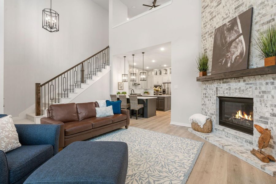 Striking open concept living - gorgeous wood look flooring -