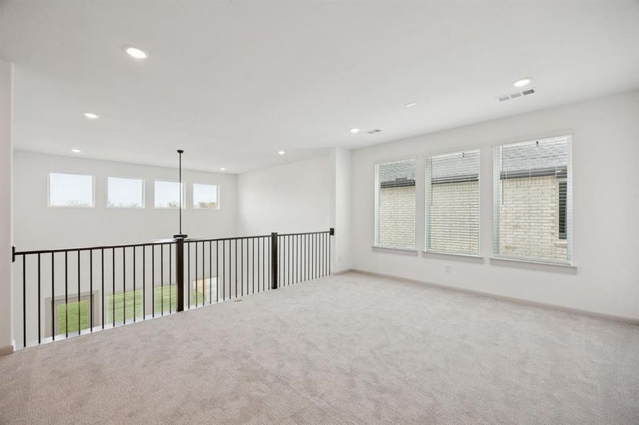 The entire family will enjoy plenty of family fun time in this spacious, light filled game room!