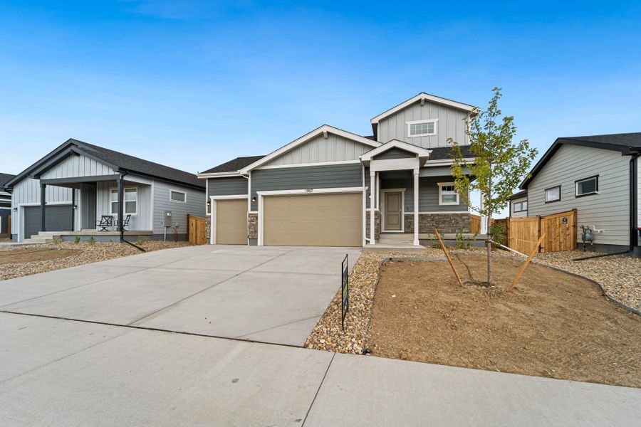 Front exterior of a new home in Granary, Johnstown, CO, highlighting curb appeal (Image 29).